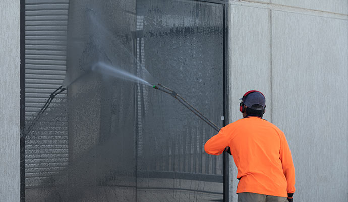 Commercial window cleaning with pressure wash