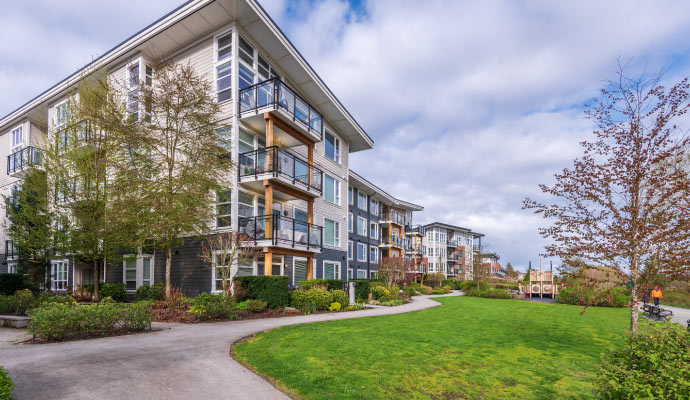 modern apartment complex with balconies and large windows