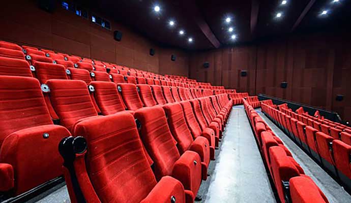 Empty movie theater with red seats