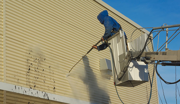 Wall washing with pressure washer