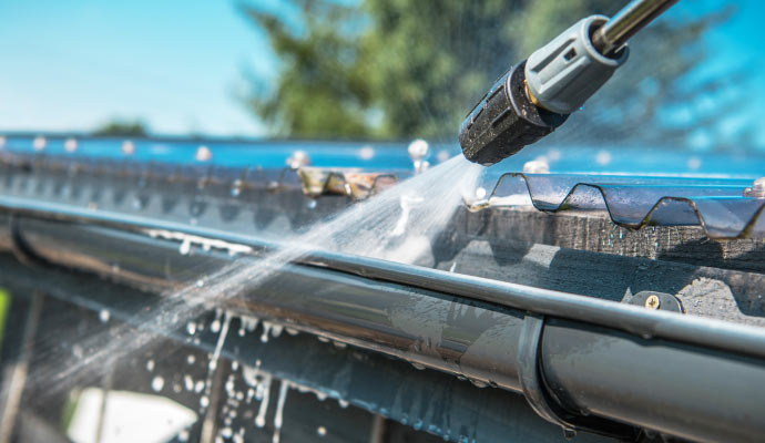 Gutter cleaning with pressure wash