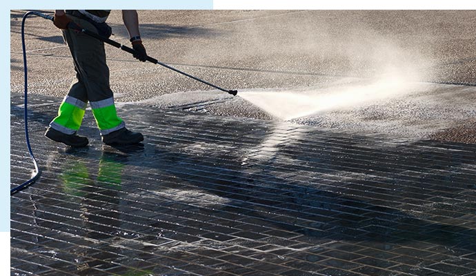 Cleaning parking lots with pressure washing.