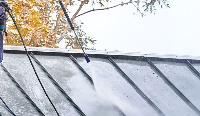 Roof cleaning with pressure washer