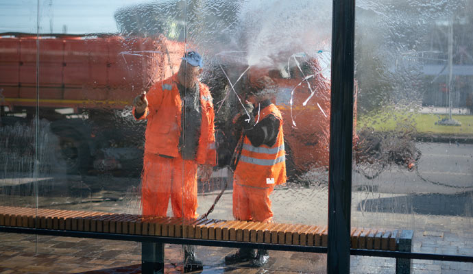 two people performing commercial window cleaning